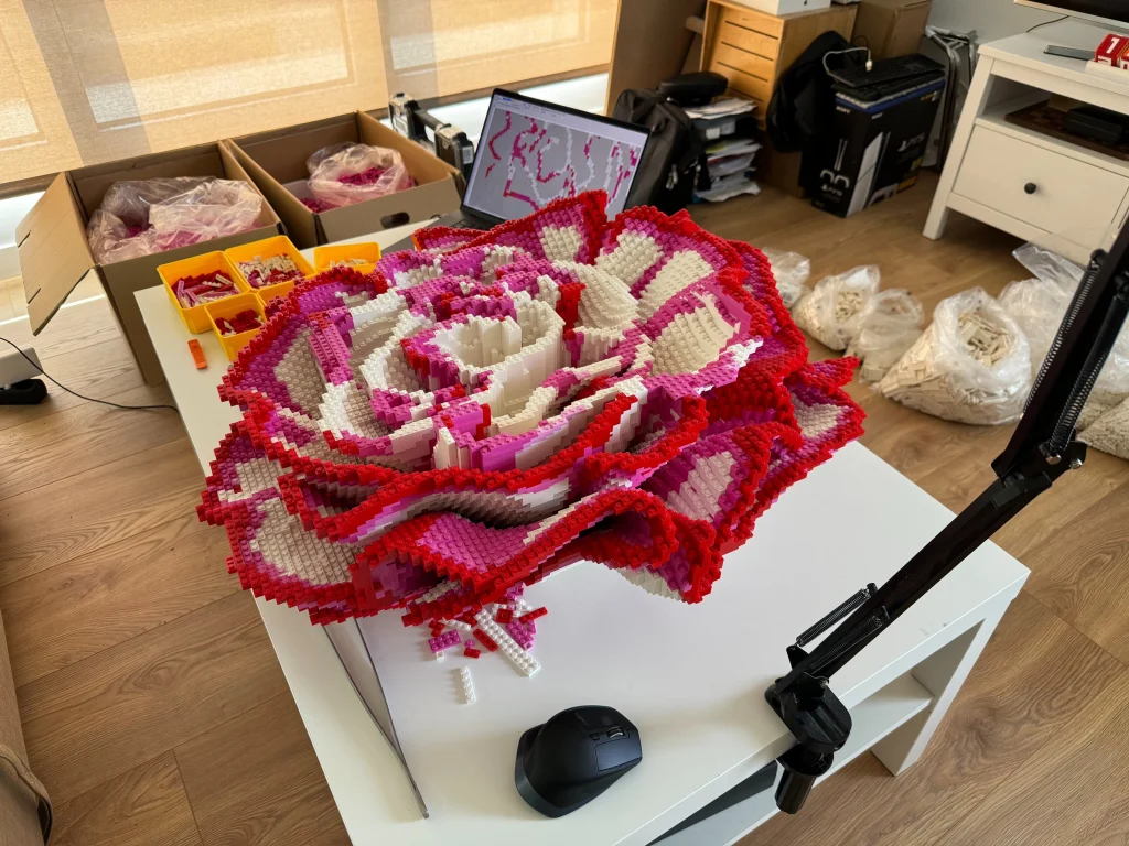 Side view of the final assembly process for a LEGO sculpture of Clavel, created for display at the LEGO store in the Puerto Venecia Shopping Center in Zaragoza