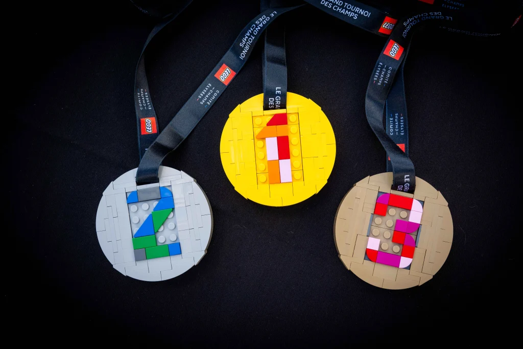 Close-up of the first-, second-, and third-place medals made from LEGO for the Grand Tournoi des Champs de Paris
