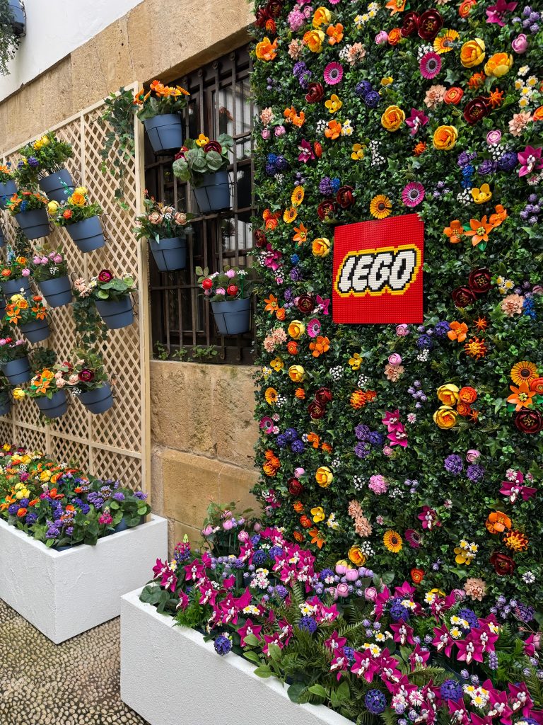 A wall of flowers and LEGO flower pots designed and built for the Patios Festival in Córdoba. 
