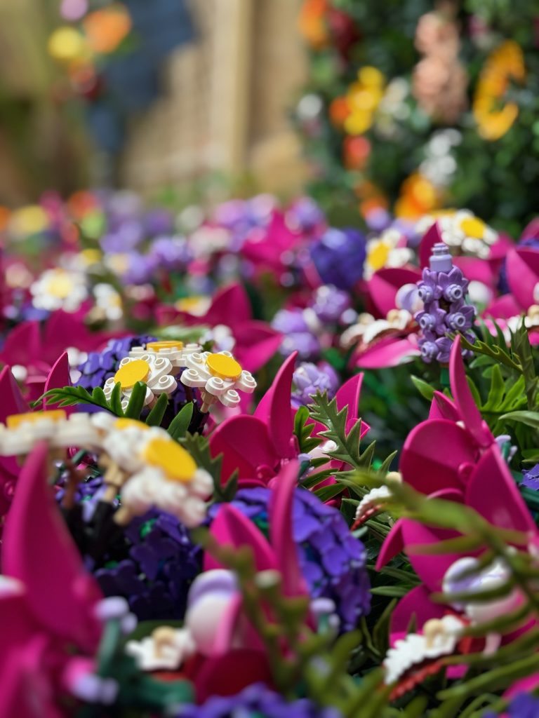 Close-up of an orchid on a flower wall built with LEGO for the Patios Festival in Córdoba