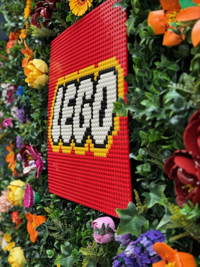 A LEGO logo created as a mosaic, located on the flower wall built for the Córdoba Patios Festival. 