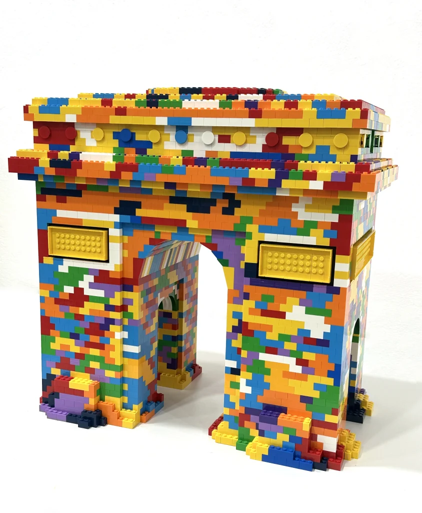 Right-side view of a colorful replica of the Arc de Triomphe made with LEGO