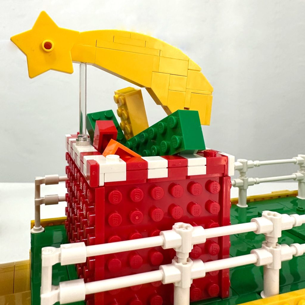 Close-up of the gifts and the Star of Bethlehem at the top of the LEGO float replicas that were featured in the 2025 Three Kings Parade in Madrid 